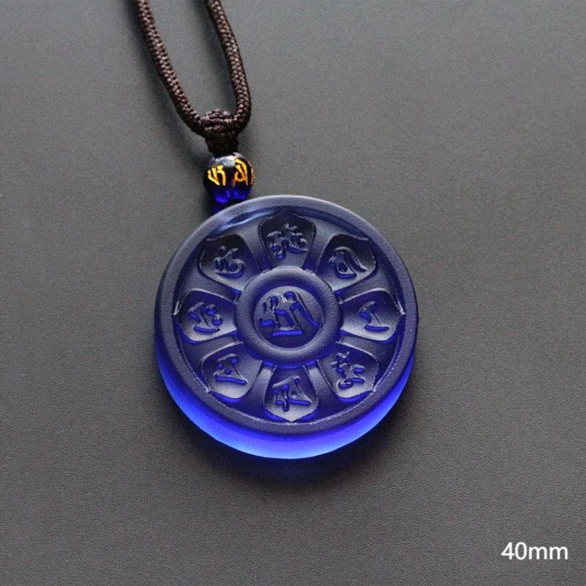 Blue Liuli Manjusri Buddhist necklace pendant with carved mantras flat lay view showing 40mm size