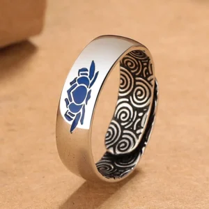 Blue lotus auspicious clouds copper ring tilted side view showing detailed cloud engravings and adjustable band