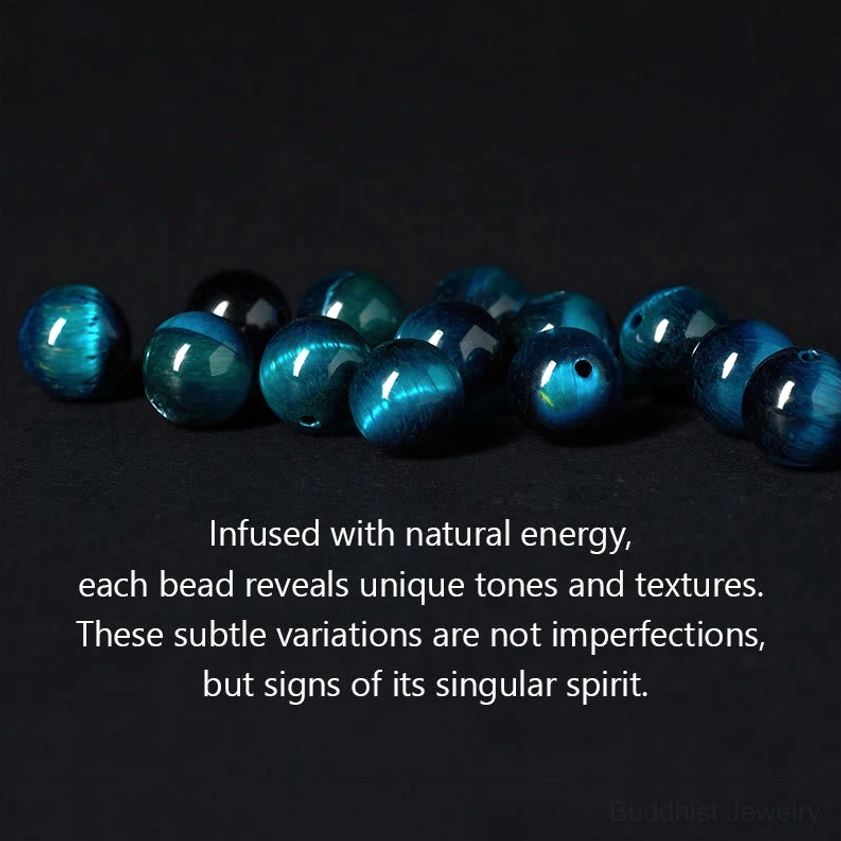 Loose natural blue tiger eye beads displaying unique cat-eye texture and color variations with informational text about natural stone characteristics