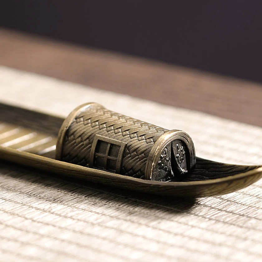 Antique bronze boat cabin with woven rattan texture and small window detail