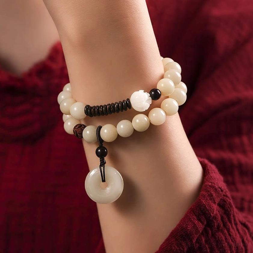 Worn bodhi sandalwood peace bracelet on wrist showing comfortable double wrap fit and spiritual harmony design in daily wear