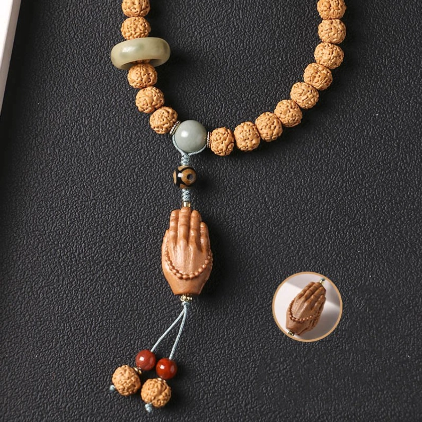 Partial bodhi seed Buddhist bracelet set featuring three-eye Dzi bead, jade ring accent, and natural beads on dark matte surface