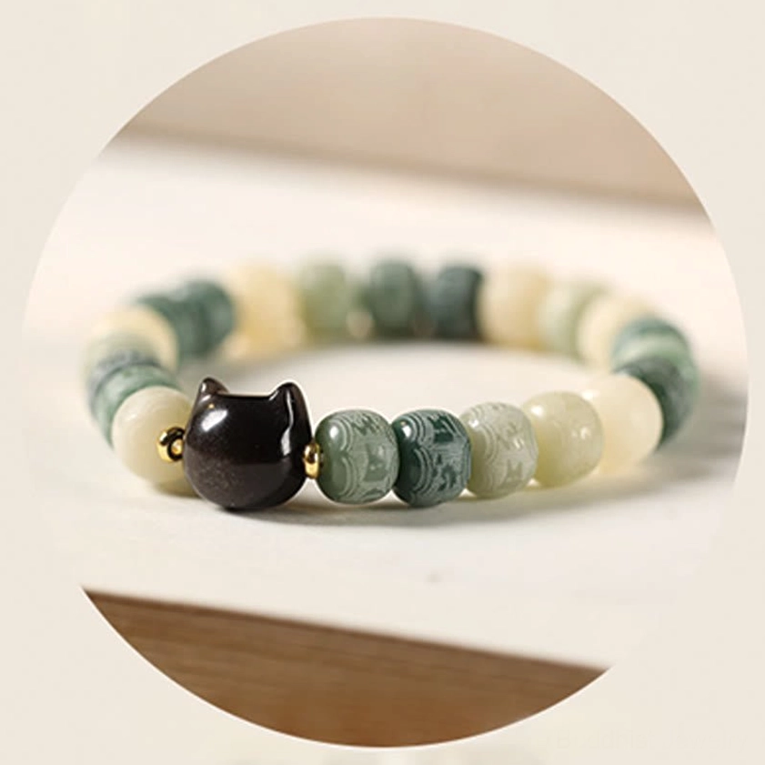 Bodhi seed bracelet bead arrangement showing Om Mani Padme Hum mantra carved details and symbols