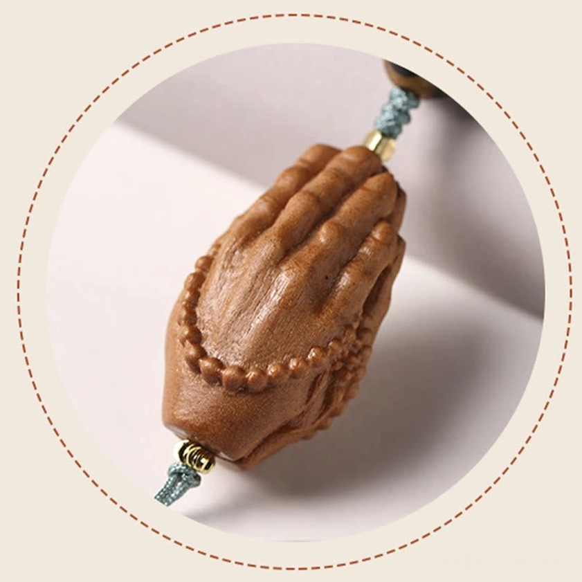 Handcrafted bodhi seed Buddhist bracelet featuring authentic three-eye Dzi bead and carved Buddha hand talisman