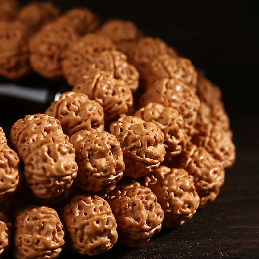 Bodhi seed and three-eye dzi bead mala showing spiritual significance and protective symbolism details