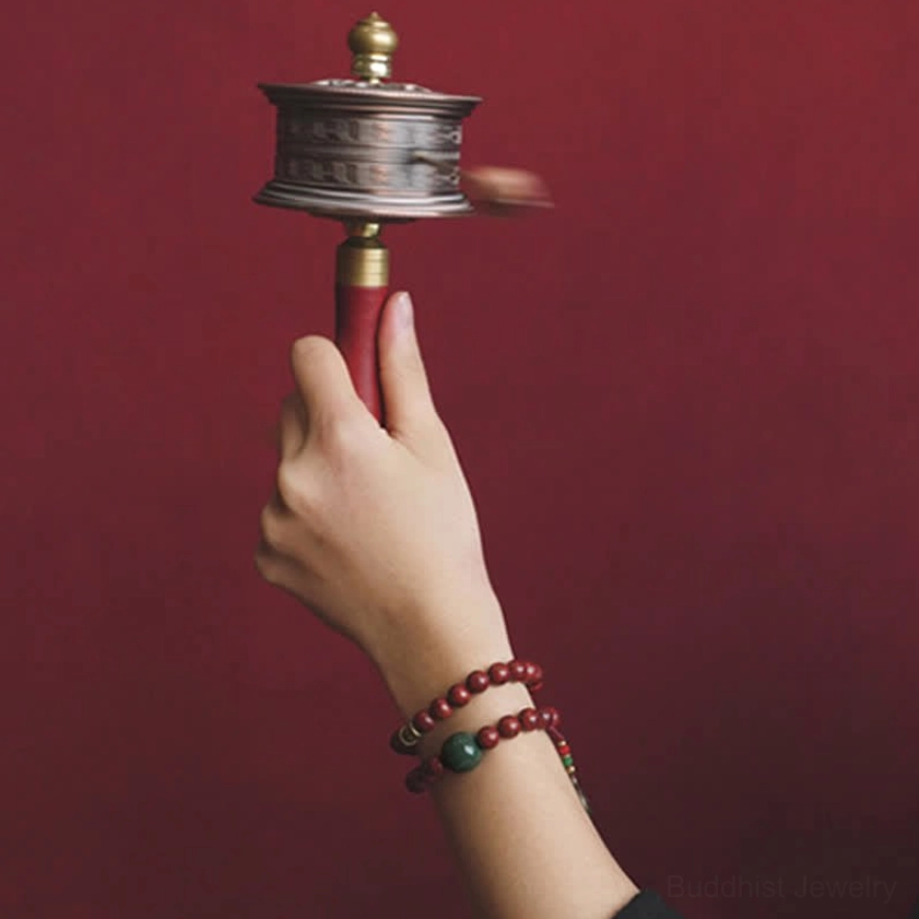 Cyan jade bodhi seed bracelet stacked wear style showing double-loop design with metal embellishments