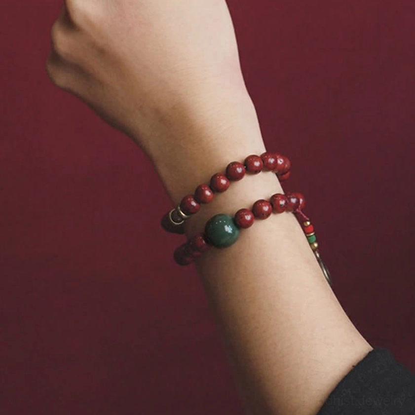 Bodhi and cyan jade bracelet worn on wrist side view showing metal spacers and double-layer style