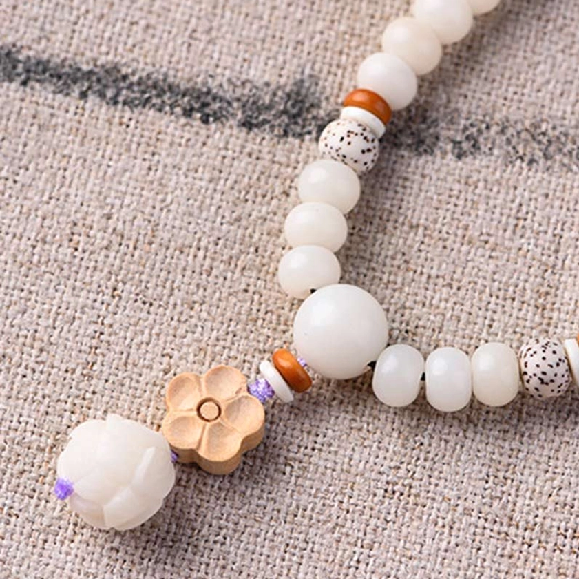 Bodhi lotus spiritual bracelet with detailed lotus flower and boxwood spacer beads