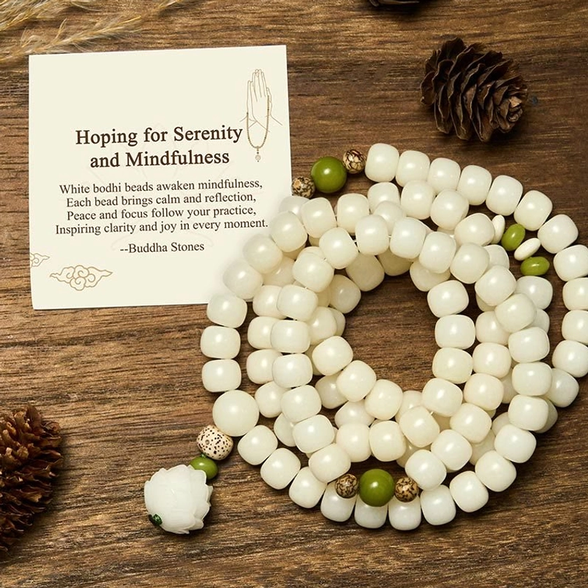 Natural white bodhi prayer mala with carved lotus flower pendant detail, 108 beads arranged overhead