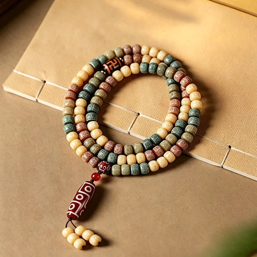 Double-strand bodhi mala necklace bracelet - flat lay on vintage paper