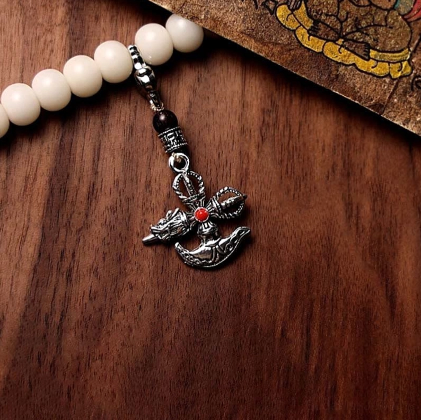 Single Buddhist mala strand with silver vajra pendant and red inlay, white bodhi seed beads, meditation necklace