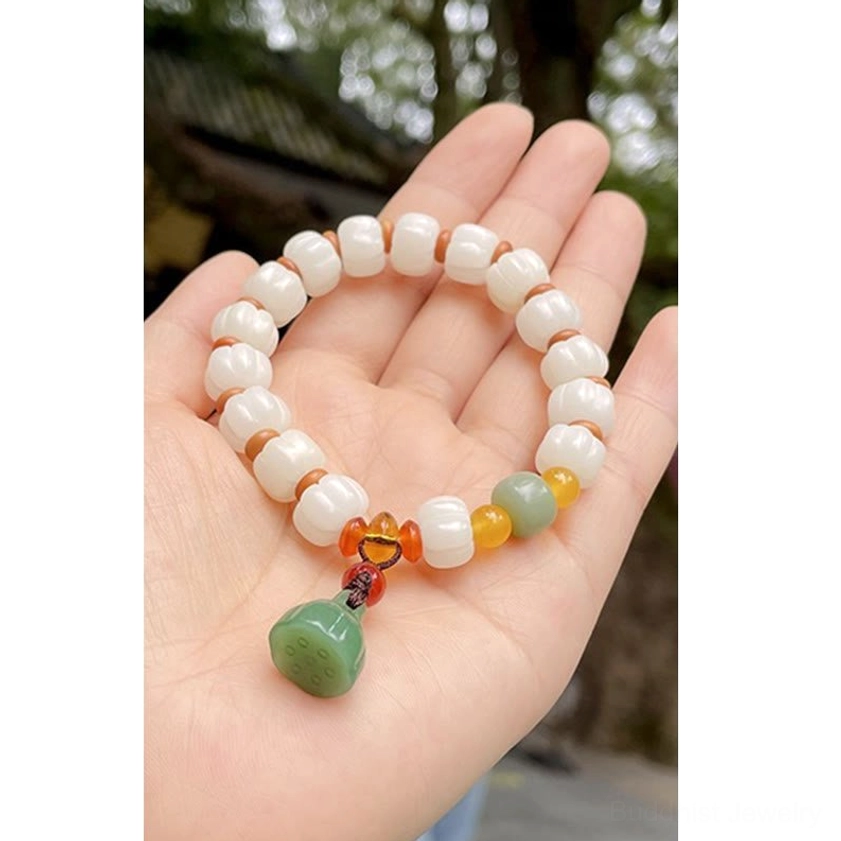 Natural bodhi seed bracelet with pumpkin beads and lotus charm for calm and harmony
