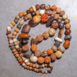 Authentic bodhi seed 108 mala beads Buddhist prayer bracelet with natural brown seed beads and colorful accent beads flat lay view