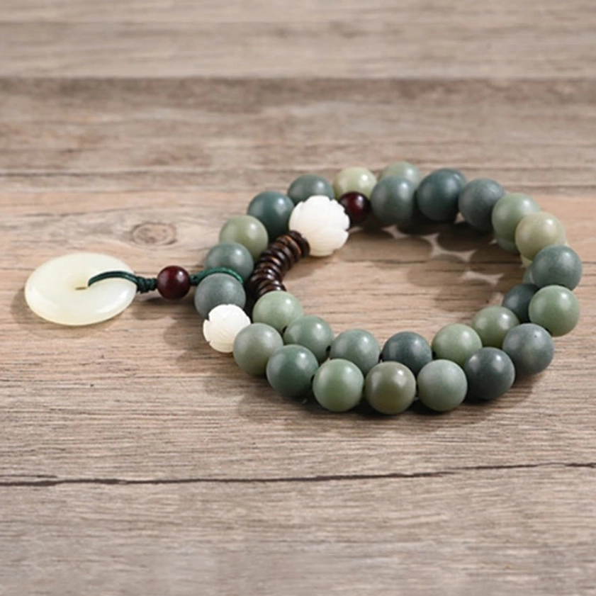 Cyan bodhi seed Buddhist bracelet with 10mm beads showing natural texture and jade peace buckle pendant product detail