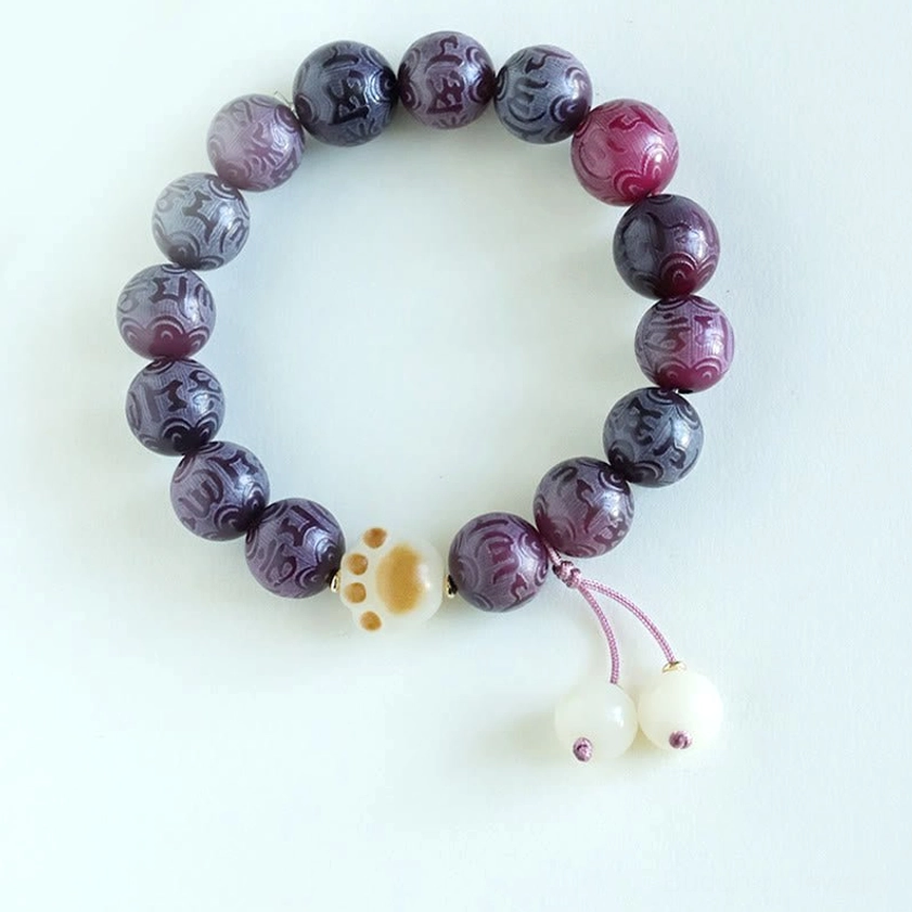 Bodhi Seed Buddhist bracelet stretched to show flexibility and elastic string construction for comfortable wear