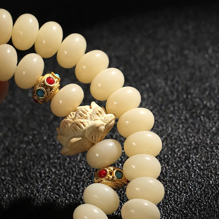 Handmade bodhi seed and peach wood bracelet detail shot - natural materials and craftsmanship of Buddhist spiritual jewelry