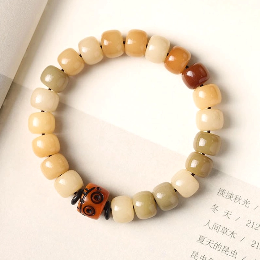 Bodhi seed Buddhist prayer bracelet multiple angles view showing variety of bead styles, focal bead designs and overall bracelet appearance