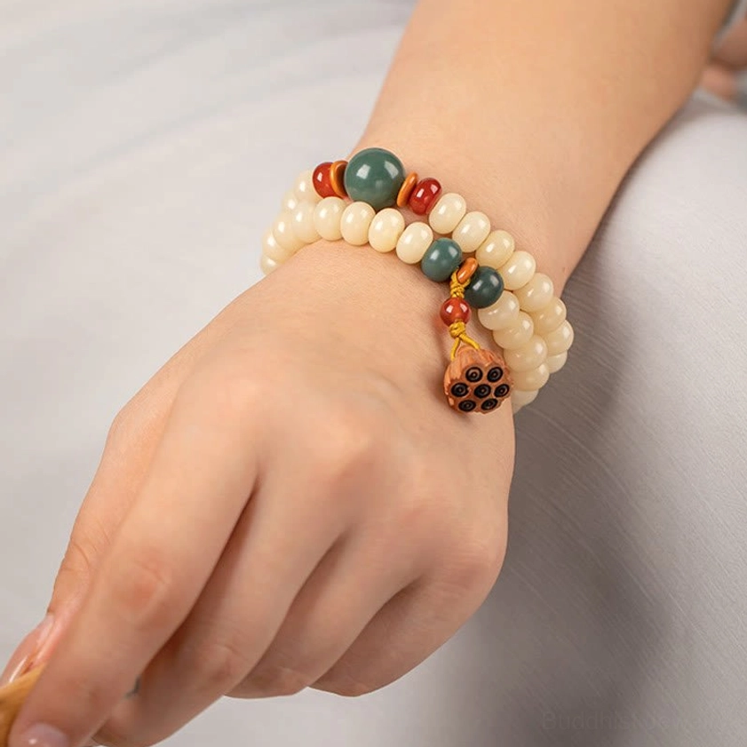 Bodhi seed meditation bracelet with lotus charm in natural lighting highlighting authentic bead colors