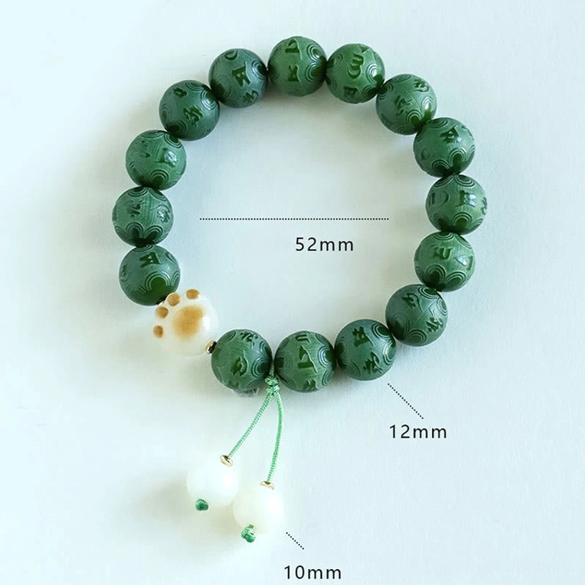 Bodhi Seed bracelet size guide showing 12mm bead diameter, 10mm charm size, and 52mm total diameter measurements