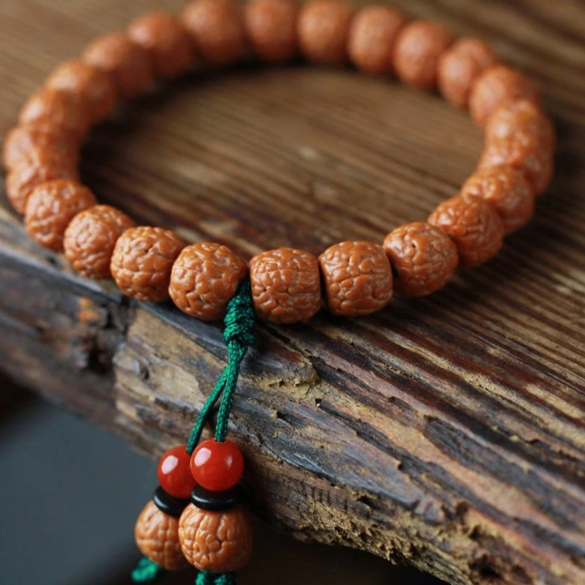 Authentic Bodhi seed beaded bracelet overhead view with spiritual charm decorations