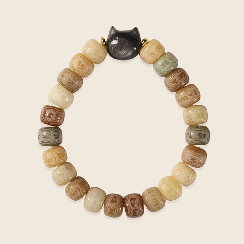 Warm gradient bodhi seed bracelet with obsidian cat charm, full overhead view showing bead color variations