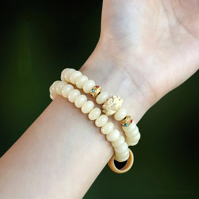 Bodhi seed lotus bracelet worn on wrist - showing the double wrap style and fit of the spiritual Buddhist bracelet
