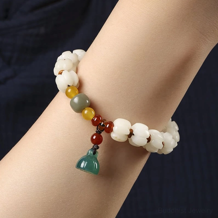 Bodhi seed lotus bracelet worn on wrist close-up side view demonstrating comfort fit