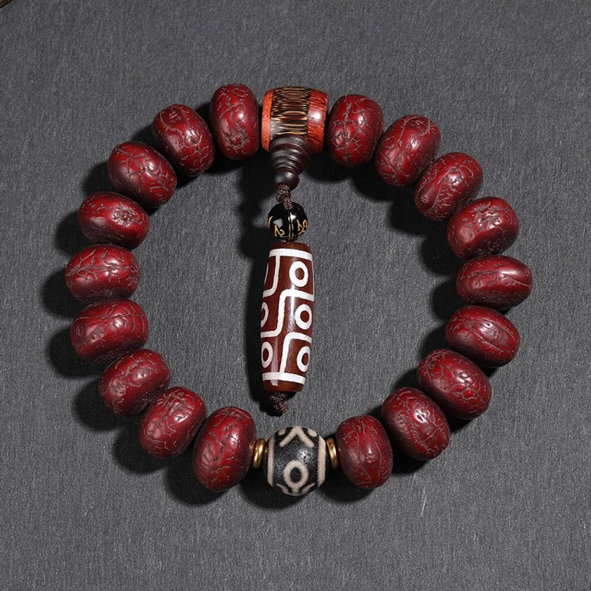 Meditation wrist mala - deep red bodhi seeds with carved retro-patterned dzi bead and black-white stones