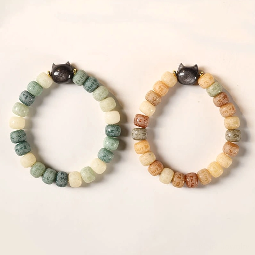 Sacred bodhi seed and obsidian cat bracelet detail shot, showing craftsmanship and spiritual symbolism of each bead