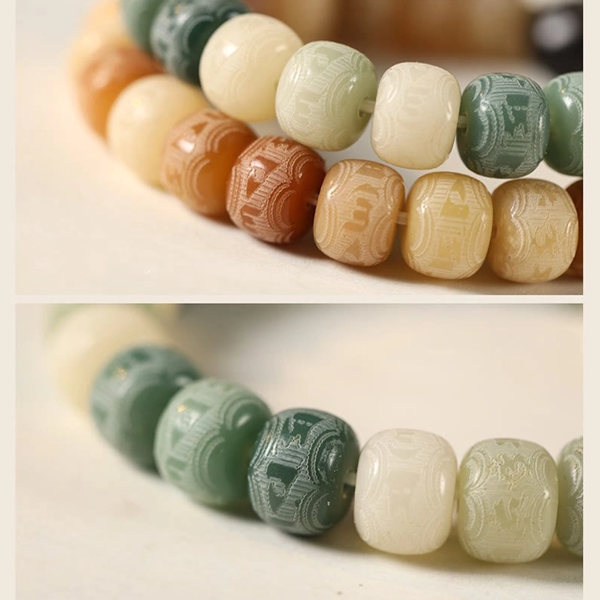 Bodhi seed cat head bracelet on book and fabric background, spiritual practice jewelry for daily wear and meditation