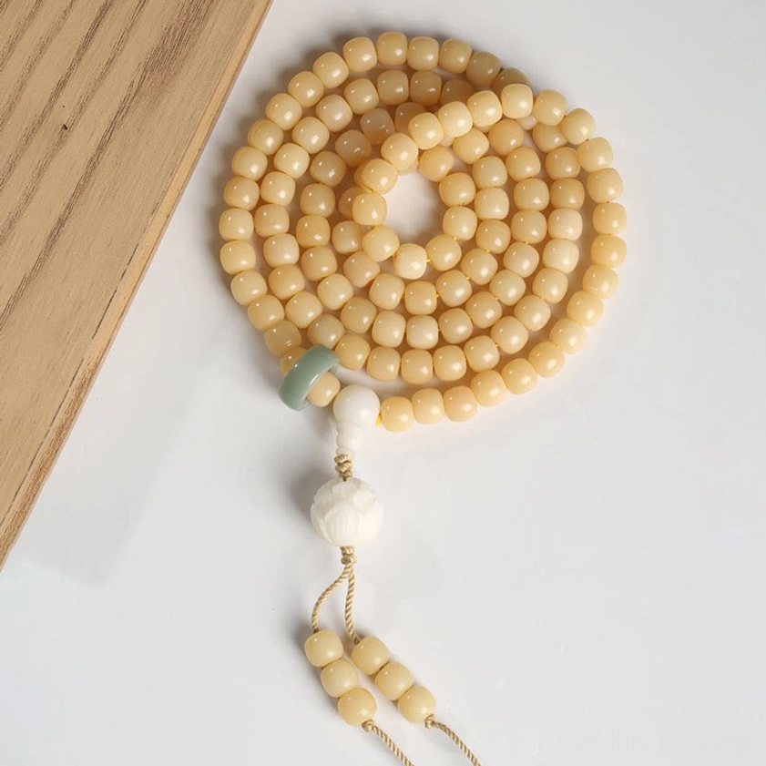 Complete Bodhi Seed Prayer Beads Set flat-lay with lotus pendant and tassel on wooden surface