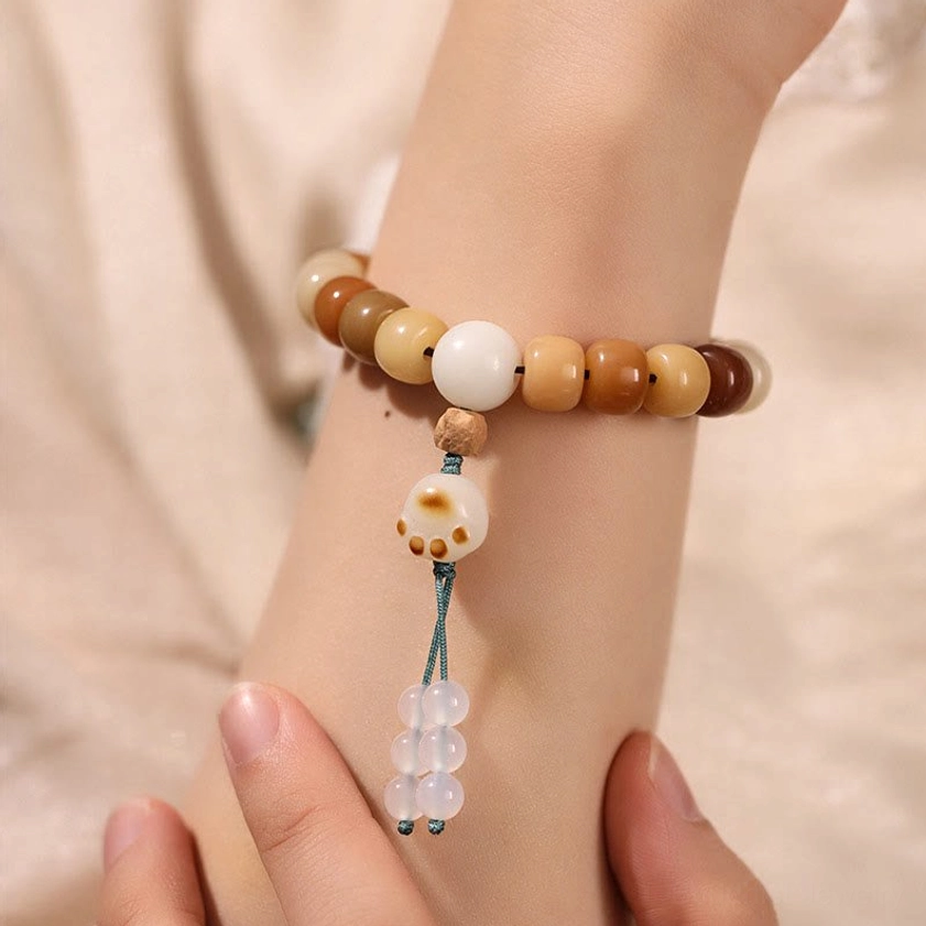 Bodhi seed bracelet with copper coin accent, earthy barrel beads with copper charm element, prosperity and good fortune Buddhist jewelry