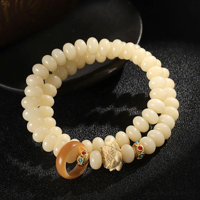 Natural bodhi seed bracelet with wooden lotus charm - authentic Buddhist bracelet for meditation and spiritual practice