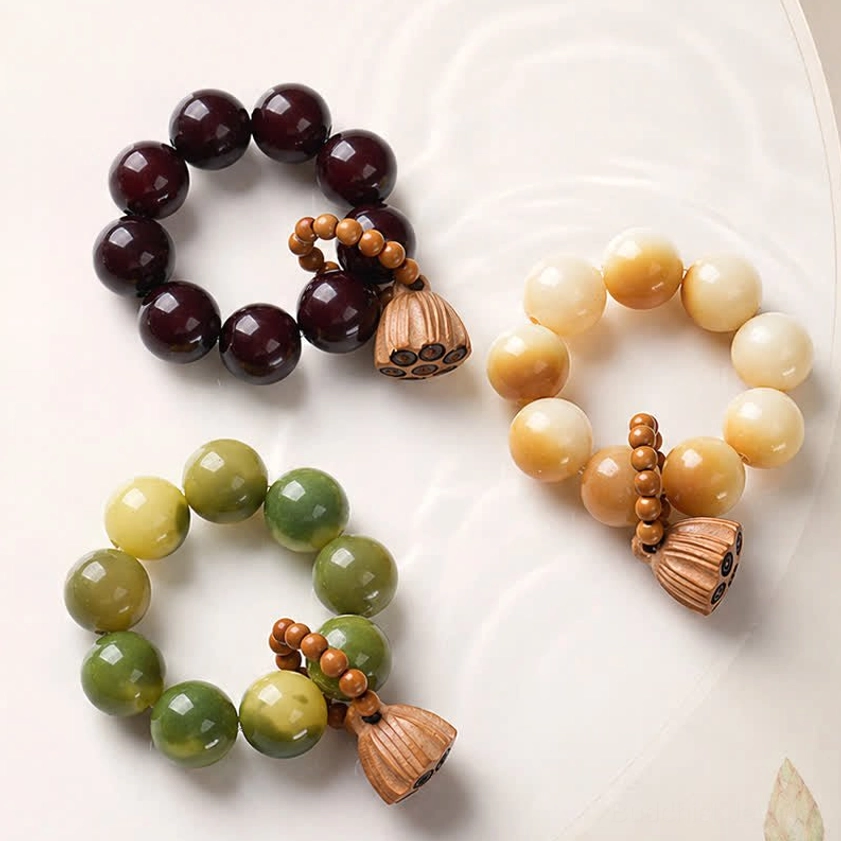 White bodhi seed lotus meditation bracelets collection in multiple color styles with hand-polished beads and wooden lotus pendants