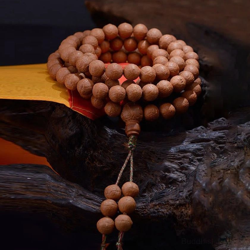 Close-up of authentic Bodhi seed prayer beads showing natural eye texture and matte finish