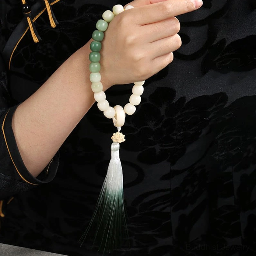 Bodhi seed wrist mala showing intricate beadwork, gradient tassel design, and spiritual charm pendant - artisan Buddhist meditation bracelet detail