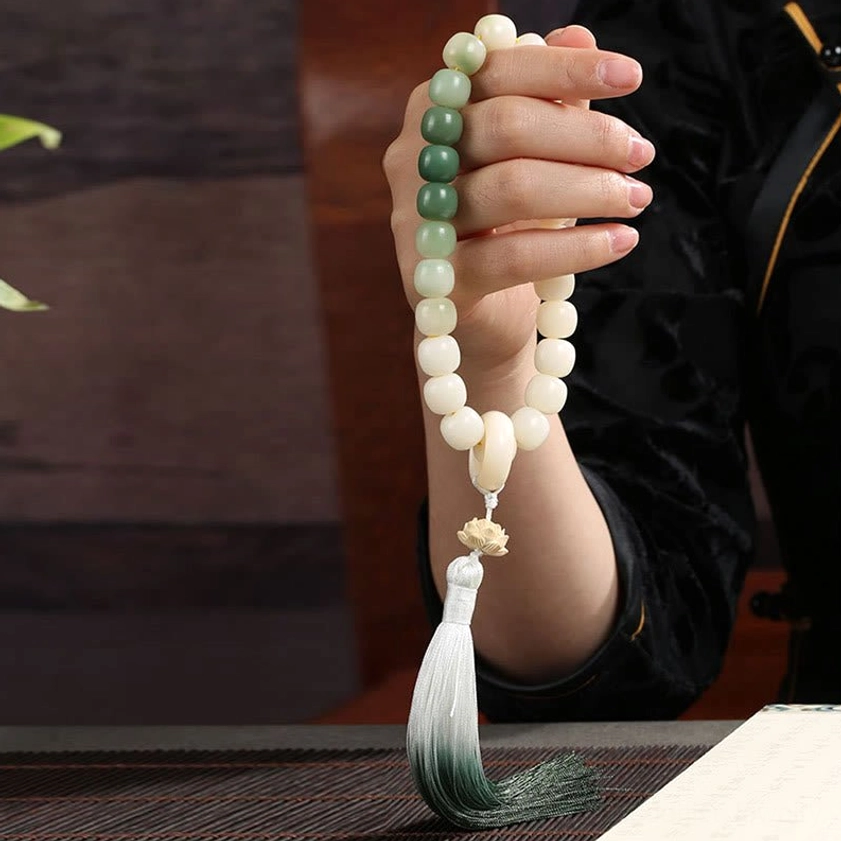 Bodhi seed wrist mala bracelet components including boxwood lotus charm, agate rings, and green aventurine beads - handcrafted Buddhist prayer jewelry materials