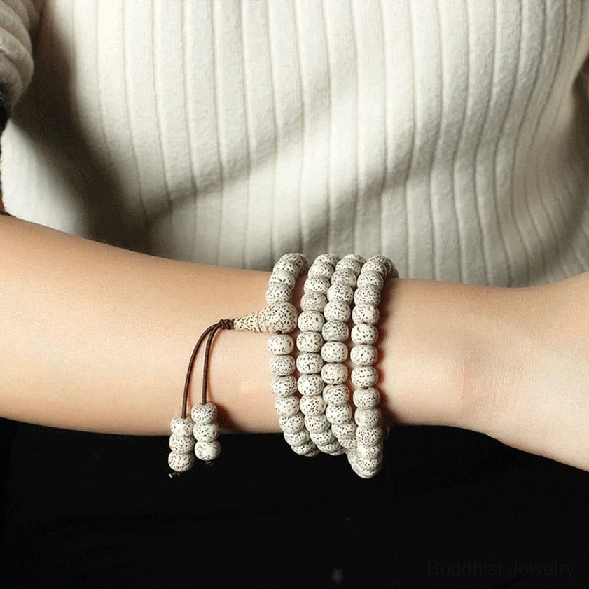 Wearable bodhi seed stacked bracelets worn on arm against knitted fabric, daily wear perspective