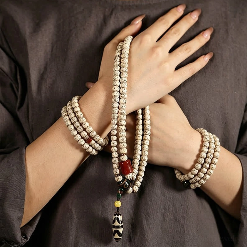 Buddhist prayer bracelet worn on hands showing how to wear mala as protective daily spiritual jewelry