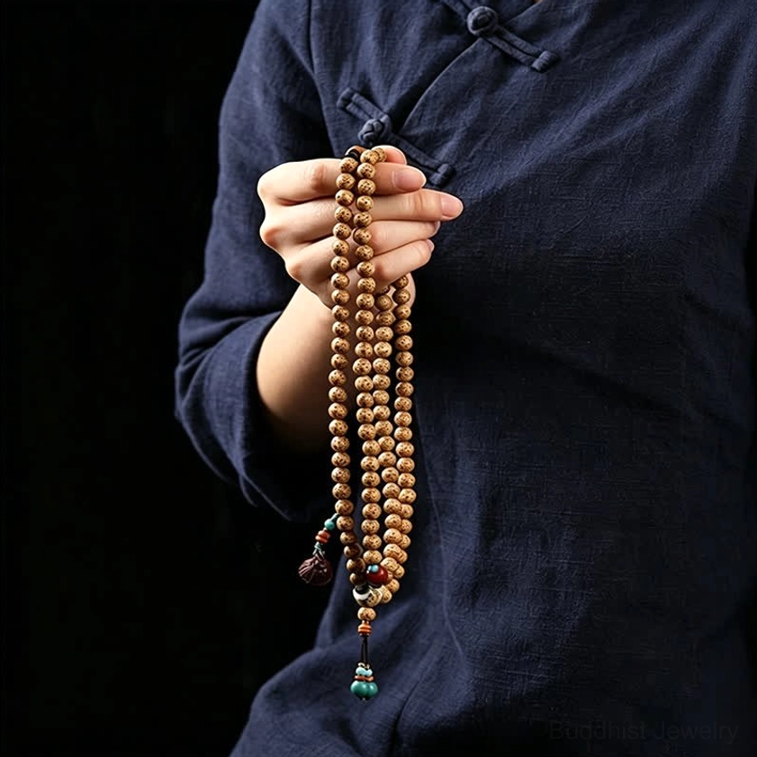 Authentic handcrafted Star Moon Bodhi Seed mala with copper spacers and wooden lotus charm detail view