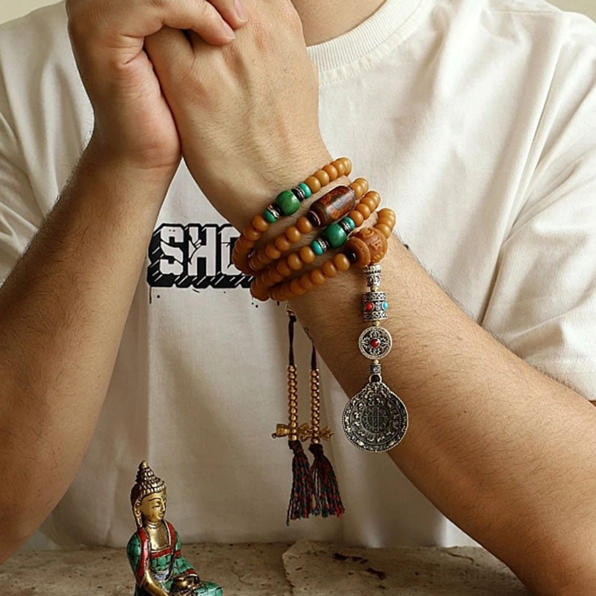 Multi-Loop Bodhi Seed Mala Wrap Bracelet with Silver Amulets and Tassel Details on Hand