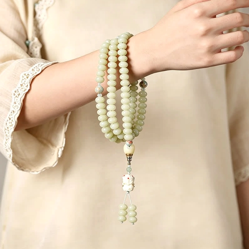 Two stacked white bodhi seed mala bracelets worn on wrist with Tara pendant showing how to wear as bracelet
