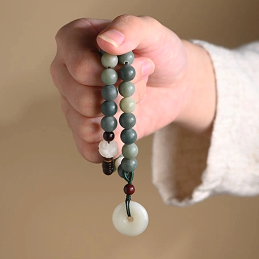 Cyan bodhi seed bracelet for meditation practice showing jade peace buckle charm and complete beaded design for spiritual wellness