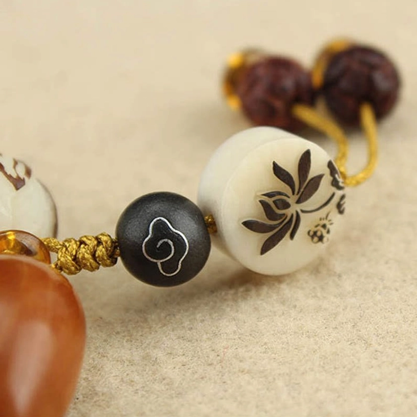Bodhi seed meditation bracelet showcasing lotus and bead arrangement for Buddhist spiritual practice
