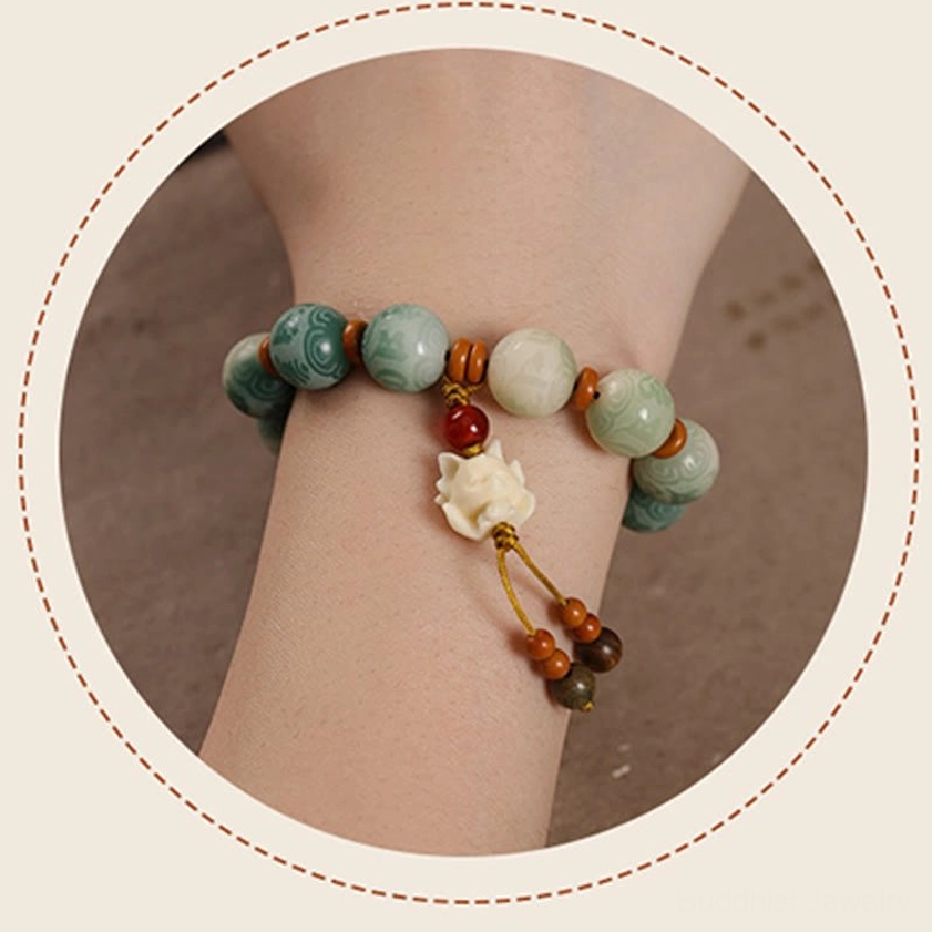 Authentic Bodhi seed meditation bracelet with protective charm pendant featuring intricate craftsmanship