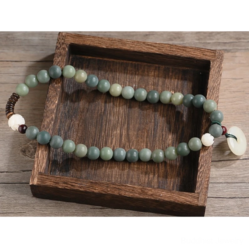 Double wrap bodhi seed bracelet with jade peace buckle ideal for meditation, mindfulness, and spiritual practice wearing on wrist
