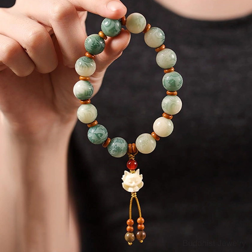 Sacred Bodhi seed Om Mani Padme Hum bracelet with carved beads and protective pendant charm