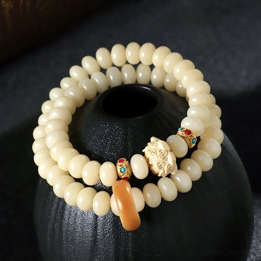 Bodhi seed peach wood lotus bracelet - complete product view showing all components and double wrap design