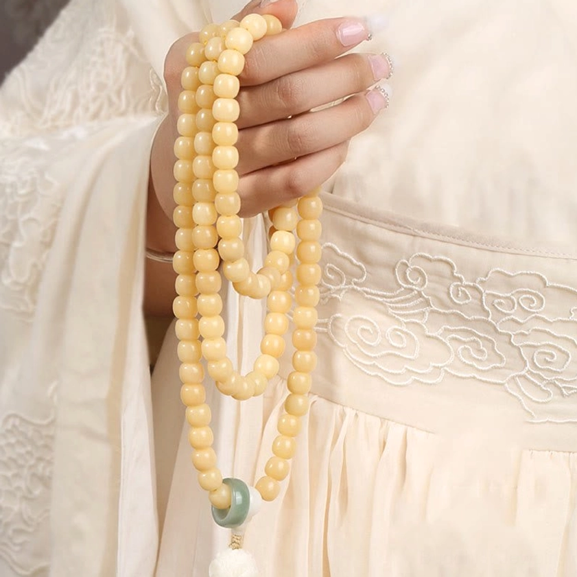 Long Bodhi Seed Prayer Beads front hand-holding close-up with natural bead arrangement
