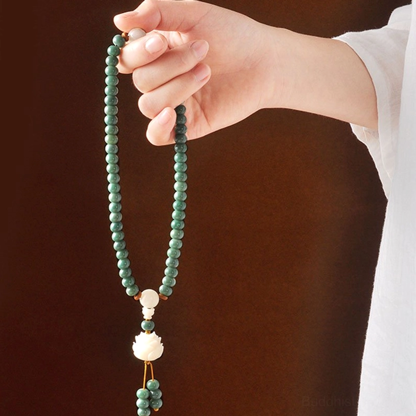 Long cyan bodhi seed prayer necklace in single strand display, featuring white lotus tassel pendant - Buddhist mala beads for meditation practice
